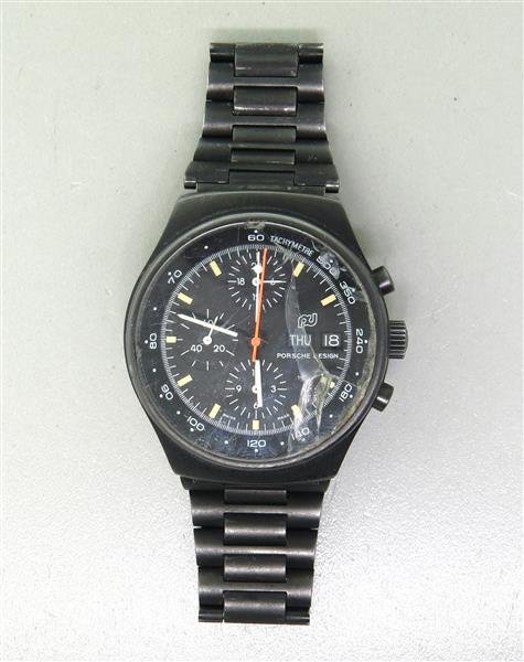 Porsche Design Day Date Automatic Watch 7176S: Case - 40mm in diameter. Automatic movement - not running. Crystal is damaged and needs replacement. Three reg chronograph, day and date at 3 o'clock. Watches are guaranteed to be in running order