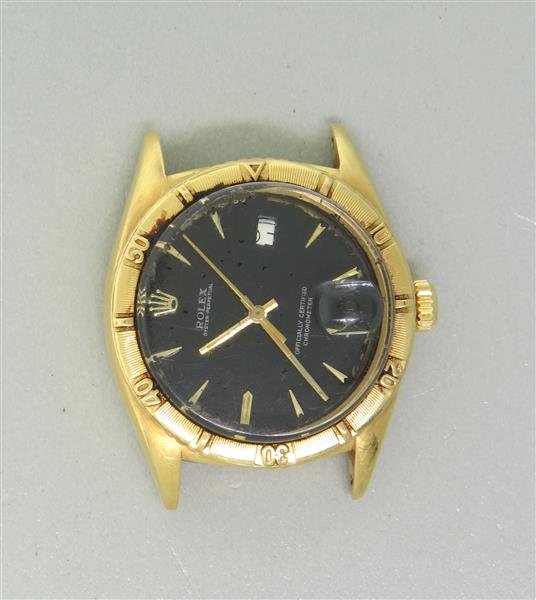 Rolex Chronometer 18k Gold Watch ref 6309: 18k gold case 35mm in diameter. Automatic movement - not running. Black dial, some paint peel, dial is off center. 25 jewel movement, cal. 1030, 5 positions. Ref. 6309.Watches are guaranteed to be in