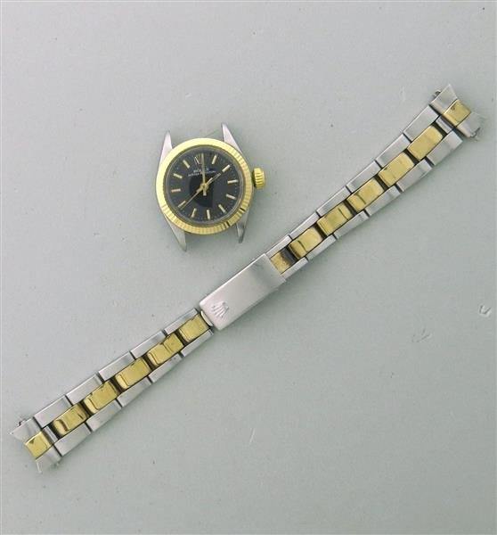 Rolex 18k Gold Steel Oyster Perpetual Watch ref 6623: Case - 24mm in diameter, gold bezel. Black dial with gold stick markers, Rolex screw down crown. Automatic 26 jewel movement, adj. 5 positions, cal. 1161. Not running, some rust on movement - balance