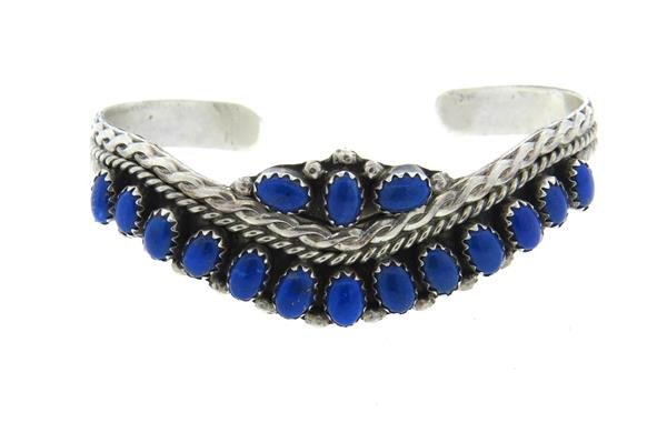 Native American Sterling Lapis Bracelet: Sterling cuff bracelet with lapis lazuli stones. will fit up to 6 1/2" wrist and is 20mm at widest point. Marked sterling HN. weight - 16.5 grColor stones have not been tested for color and clari