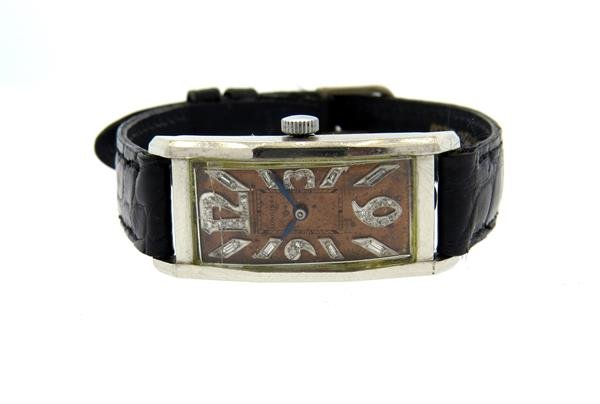 1930s Platinum Longines Diamond Watch cal. 9L: Platinum case - 19mm excl crown x 43mm lug tip to lug tip. Diamond numerals. Copper dial, crystal is cracked, original. 17 jewels movement, 9L cal. - running order.Color stones have not been tested fo