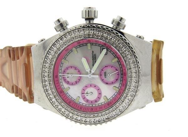 TechnoMarine Mother of Pearl Diamond Watch: Case - 36mm in diameter. Diamond bezel, mother of pearl dial with 3 reg. chronograph,date at 4 o'clock. Quartz movement - running order. Original pink rubber band and steel buckle. Band is split i