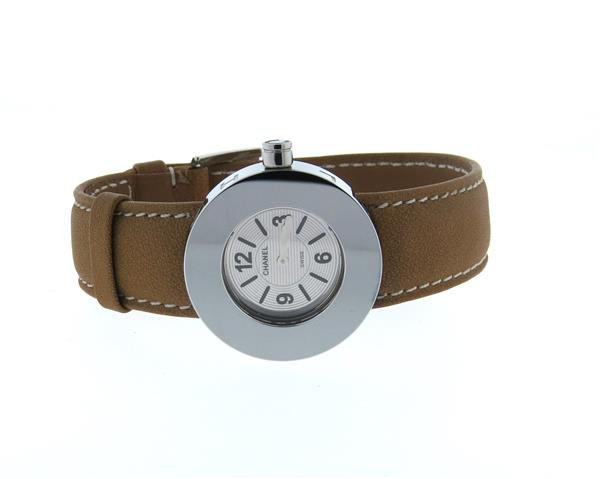 Chanel La Ronde Stainless Steel Leather Band Watch: Steel case - 29mm in diameter excl. crown. Silvered dial with black stick and arabic markers. Original crown, leather band. Quartz movement - running order. Watch is new old stock, with tag and protec