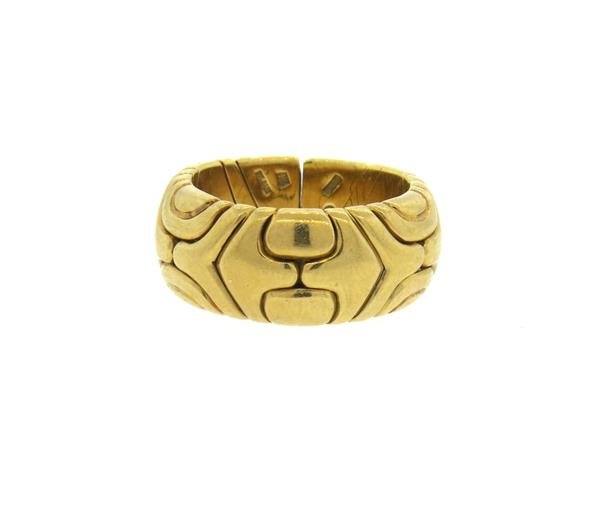 Bvlgari Bulgari Tubogas 18k Gold Band Ring: Ring size 7 (slightly flexible - ring has an opening), ring is 9.5mm wide. marked 750,Bvlgari,made in Italy. Weight - 18.1 grams.Gemstones have not been graded for color and clarity ,and tested for cl