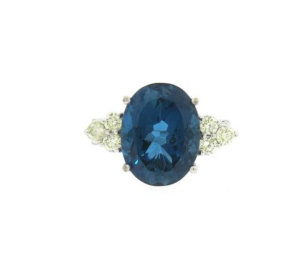 14k Gold London Blue Topaz Diamond Ring: Ring size 8 3/4, ring top is 14mm x 24mm. London blue topaz, 6 diamonds - approx. 0.60ctw. Marked 14k. Weight - 7.5 grams.Gemstones have not been graded for color and clarity ,and tested for clarity a