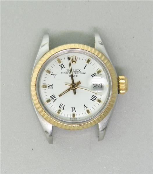 Rolex Date Gold Steel Roman Watch ref 6917: Case - 25mm in diameter. Gold bezel, white dial with roman numeral markers, date at 3 o'clock. Rolex crown. Automatic 28 jewel movement - running order, cal. 2030. Ref. 6917, serial 67*****.Watche