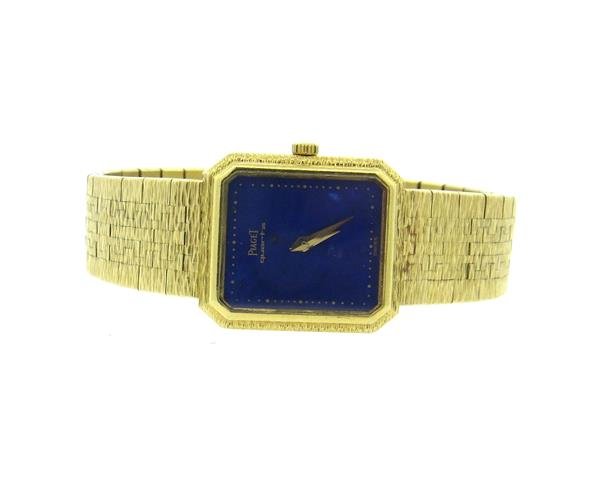 Piaget 18k Gold Lapis Dial Watch: 18k gold case - 20mm excl crown x 24mm. Lapis dial. Quartz movement - running order. Band is 18k gold - 6 1/8" long. Weight - 52.5 grams.Gemstones have not been graded for color and clarity ,and