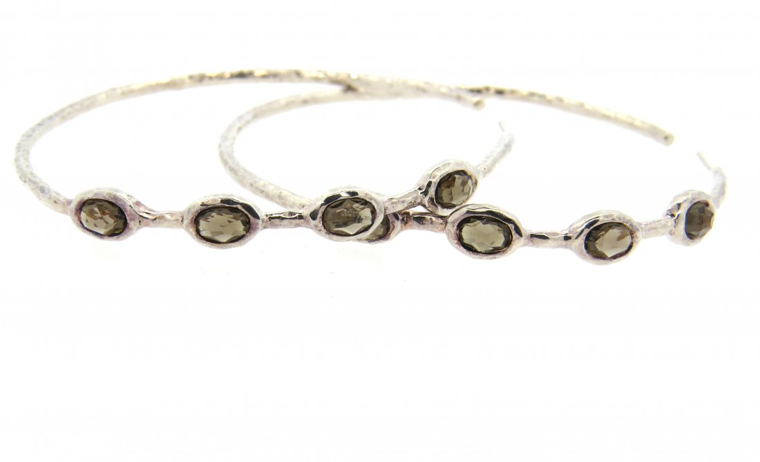Ippolita Sterling Smokey Topaz Large Hoop Earrings: Earrings are 62mm in diameter (hoops are slightly bent). Smokey topaz stones. Missing backs. Marked Ippolita 925. Weight - 16.6 grams.Gemstones have not been graded for color and clarity ,and tested f