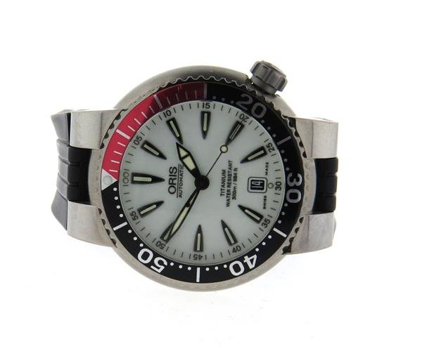 Oris Titanium Automatic Watch: Titanium case - 43mm in diameter. Rotating bezel,white dial with luminous markers. Automatic movement with skeleton back - running order, but crown does not screw. Date at 6 o'clock. Original Oris