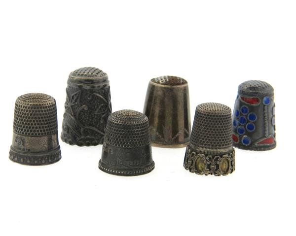 Antique Sterling Enamel Thimbles Lot of 6: Lot of 6 thimbles, one decorated with enamel. Weight of all - 22.4 grams.Gemstones have not been graded for color and clarity ,and tested for clarity and color enhancement, unless stated otherwise. Wa
