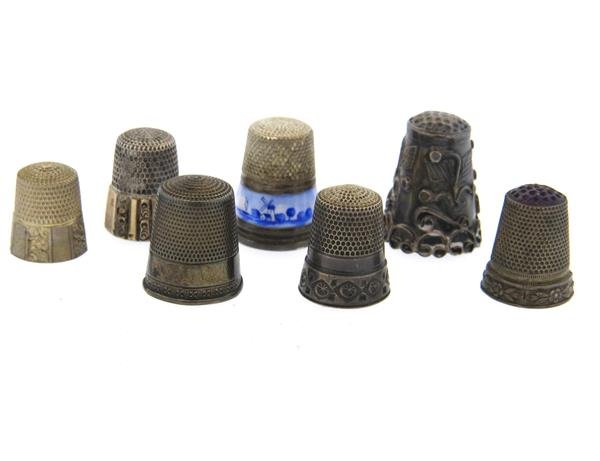 Antique Sterling Enamel Thimbles Lot of 7: Lot of 7 thimbles, one decorated with enamel. Weight - 30.9 grams,Gemstones have not been graded for color and clarity ,and tested for clarity and color enhancement, unless stated otherwise. Watches a