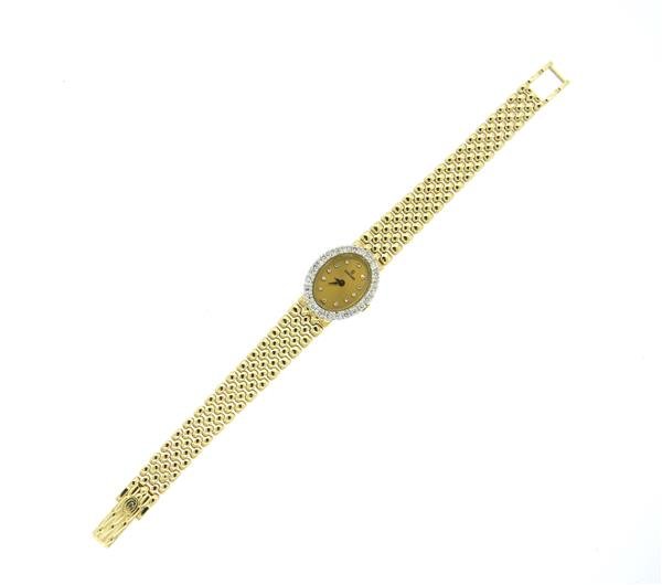 Concord 14k Gold Diamond Lady's Watch Bracelet: 14k gold case - 21.3mm x 17.7mm excl crown. Bezel set with diamonds, gold tone dial with diamond markers. Total diamond weight approx. 0.50ctw. 14k gold Concord band - 6 1/2" long. Manual wind - 