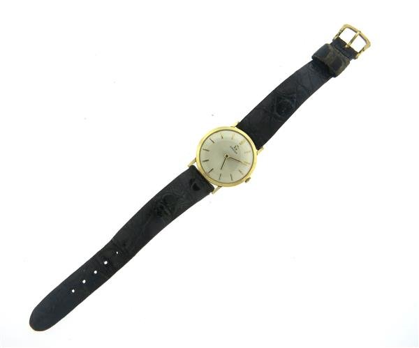 Omega 14k Gold Mid Size Watch cal. 620: 14k gold case - 29mm in diameter. Manual wind movement cal. 620 - not running. Omega leather band and buckle.Gemstones have not been graded for color and clarity ,and tested for clarity and color enha