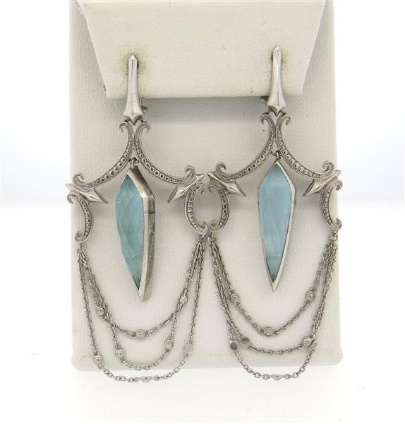 Stephen Webster Cats Eye MOP Chandelier Earrings: Earrings measure 76mm long x 31mm wide. Marked Webster hallmark, 925. Weighs 18.8 grams. One crystal is cracked internally.Gemstones have not been graded for color and clarity ,and tested for clarity