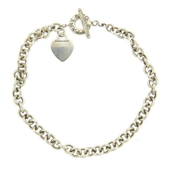 Tiffany & Co Sterling Heart Tag Necklace: Necklace is 16" long and 10mm wide. Heart - 26mm x 20mm. Engraved "J. M. M" Marked: Tiffany & Co 925. Weight - 73.4 grams. Gemstones have not been graded for color and clarity ,and