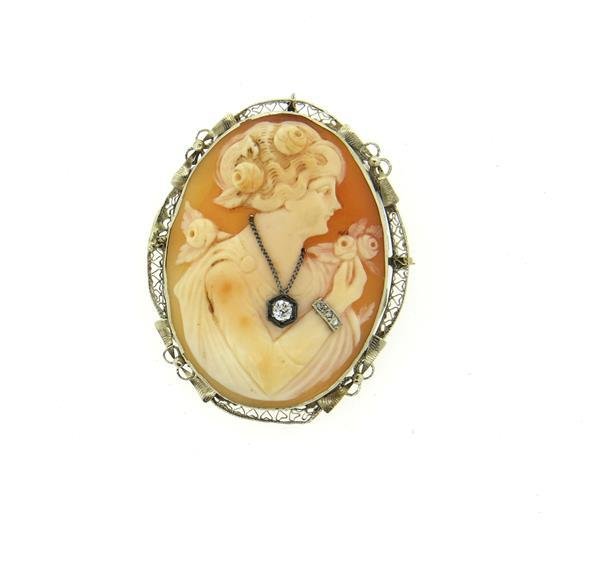 14k Gold Filigree Cameo Diamond Brooch Pendant: Brooch measures 48mm x 39mm. Set with 4 diamonds and shell cameo. Marked 14k. Weight - 11.9 grams.Gemstones have not been graded for color and clarity ,and tested for clarity and color enhancement, un