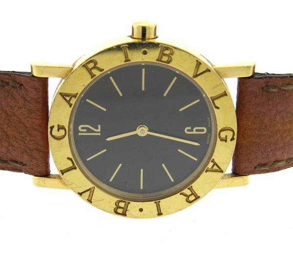 Bvlgari Bulgari 18k Gold Black Dial Watch BB 30 GL: 18k gold case - 30mm in diameter excl crown. Bvlgari leather band. Black dial with stick markers. Quartz movement - running order. Comes with box. Gemstones have not been graded for color and clarity