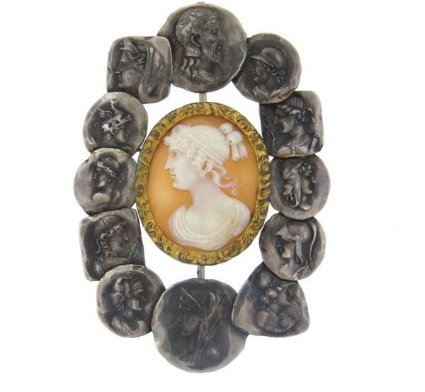 George W. Shiebler Homeric Sterling Cameo Brooch: Brooch measures 85mm x 60mm, center of the brooch features shell cameo in gold tone frame, surrounded with silver Roman coin motif frame. Marked: maker's mark, Bailey Banks& Biddle ( retailed 