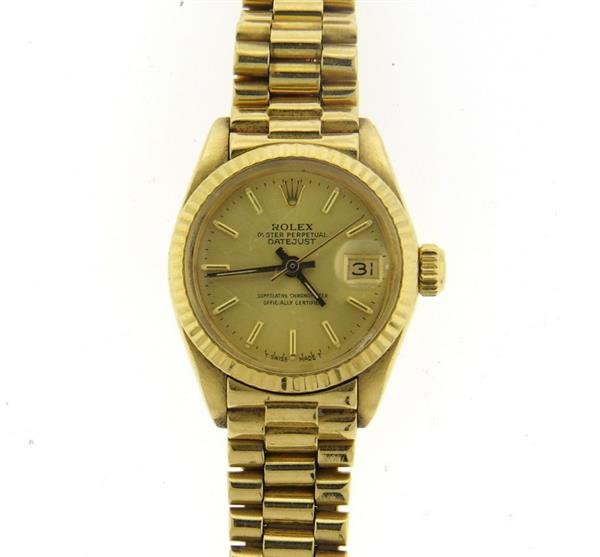 Rolex President Datejust 18k Gold Watch: 18k gold case - 25mm in diameter excl crown. 18k gold jubilee band - 6 7/8" long. Gold tone dial with gold stick markers, date at 3 o'clock. Crystal has scratches. Automatic movement - runnin