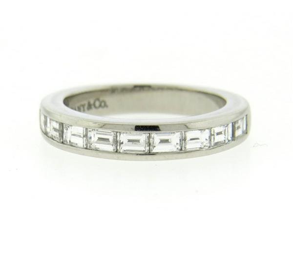 Tiffany & Co Platinum Diamond Half Band Wedding: Ring size - 4 1/4, ring is 3.6mm at widest point. Decorated with 9 baguette diamonds - approx. 0.65ctw G/VS. Marked: Tiffany & Co, pt950. Weight - 6. grams.Gemstones have not been graded for color