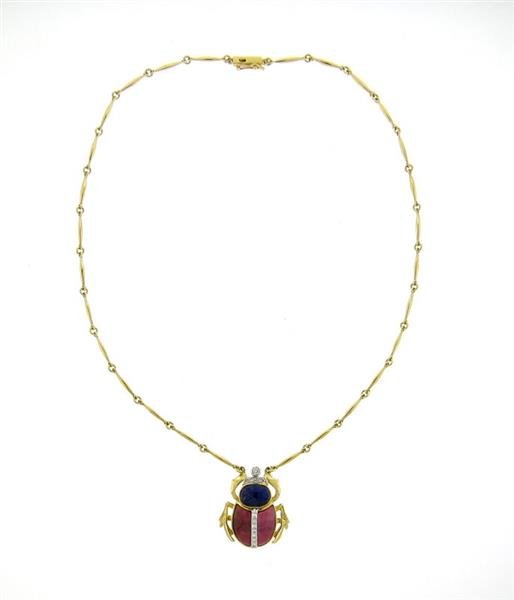 18K Gold Diamond Lapis Rhodochrosite Beetle Necklace: Unusual 18K gold beetle pendant necklace features approx. 0.07ctw of diamonds. Necklace measure 17" long, pendant measures 28mm x 25mm. Marked ADione, 750. Weight - 18.5grams. Gemstones have not 