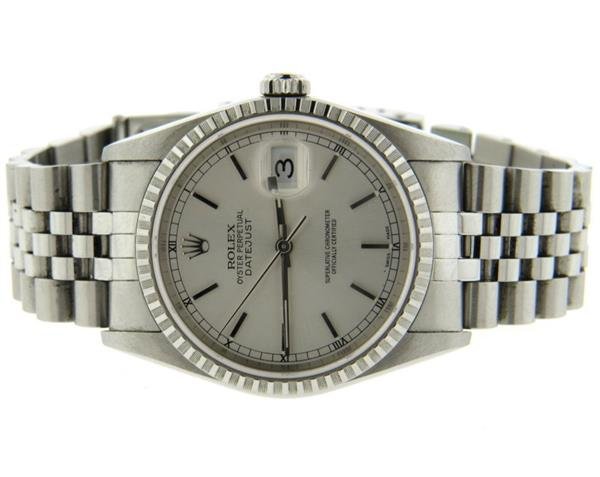 Rolex Datejust Steel Watch R16220: Stainless steel case 35mm in diameter excl crown. Silver dial with stick markers, date at 3 o'clock. Automatic movement - running order, ref E16220, serial F201***. Comes with papers.Gemstones hav
