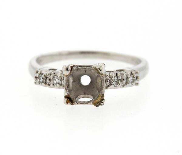 Platinum Diamond Engagement Ring Mounting: Ring mounting features approx. 0.08ctw of diamonds. Center will fit approx. 6.7mm round stone. Ring size 7.75, top measures 7.1mm at widest point. Marked 10% Irid Plat. Weight - 4.0 grams. Gemstones h