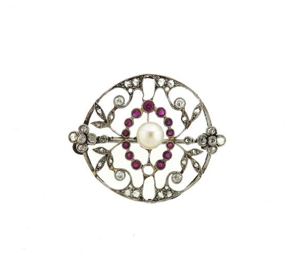 Edwardian Platinum Diamond Pearl Red Stone Brooch Pin: Platinum brooch is decorated with diamonds, red stones and pearl. Brooch measures 34mm x 27mm . One diamond and one red stone are missing. Tested platinum. Weight is 5.4 grams.Gemstones have not been 
