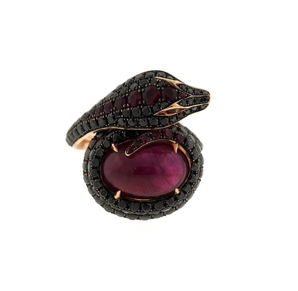 Stephen Webster 18k Gold Black Diamond Red Stone Snake: METAL; 18k rose gold. MEASUREMENTS: ring size 6 1/2, ring top is 23mm wide. GEMSTONES: black diamonds approx. 1.35ctw, red stones. MARKED: Webster mark, English gold marks, 750. WEIGHT: 13.9 grams.Gem