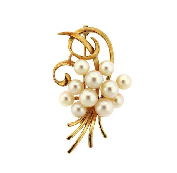 Mikimoto 14K Gold Pearl Brooch: METAL: 14K gold. GEMSTONES: pearls range from 6.4mm to 7.6mm . MEASUREMENTS: brooch is 52mm x 32mm. MARKED: M K14. WEIGHT: 12.4 grams. Gemstones have not been graded for color and clarity ,and tested 