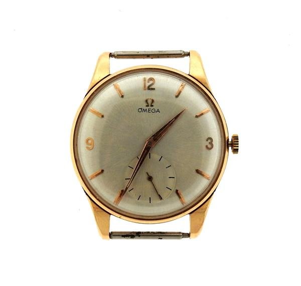 Omega 18k Rose Gold Steel Manual Wind Watch cal 267: METAL: 18k rose gold. MEASUREMENTS: 35mm in diameter x 42mm lug tip to lug tip. Omega silvered dial with gold markers, small second hand at 6 o'clock. MOVEMENT: manual wind - running order, cal 26
