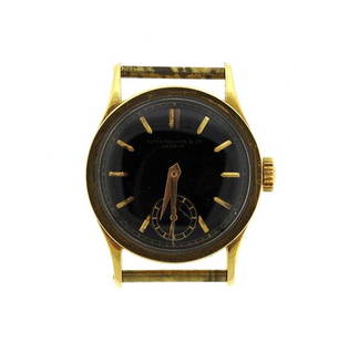 Vintage Patek Philipe Calatrava 18k Gold Watch: METAL: 18k gold. MEASUREMENTS: case - 30mm in diameter x 37mm lug tip to lug tip. DIAL: black dial signed Patek Philippe Co Geneve. with gold stick markers and small second hand at 6 o'clock. MOVE