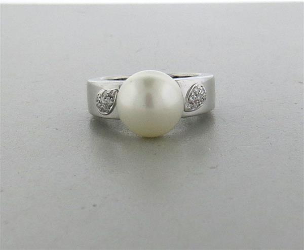 Chimento 18k Gold Diamond South Sea Pearl Ring: METAL: 18k gold. MEASUREMENTS: size 7 1/2, shank is 6.8mm wide. GEMSTONES: south sea pearl-11.5mm Diamonds approx. 0.07ctw(VS/GH). MARKED: Chimento, 408 Vi, "MIA". WEIGHT: 11.7 grams. Gemsto