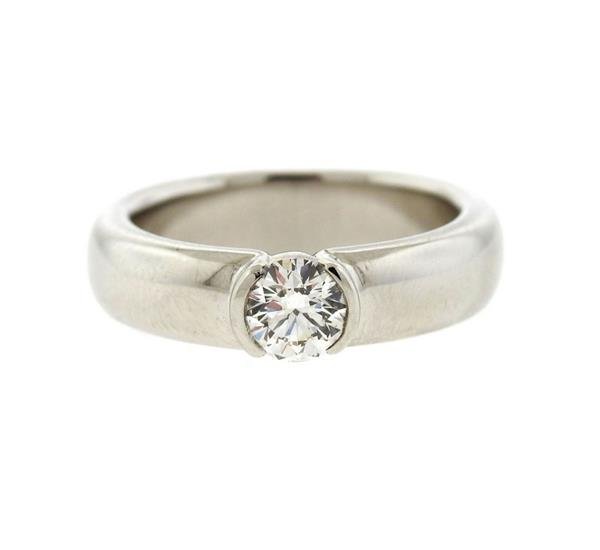 Tiffany & Co Platinum 0.52ct VS1 H Engagement Ring: METAL: platinum. MEASUREMENTS: ring size - 5, ring is 5mm wide. GEMSTONES: Round brilliant diamond - 0.52ct VS1/H, comes with a copy of T & Co cert. MARKED: D37257, .52ct, Tiffany & Co, pt950.