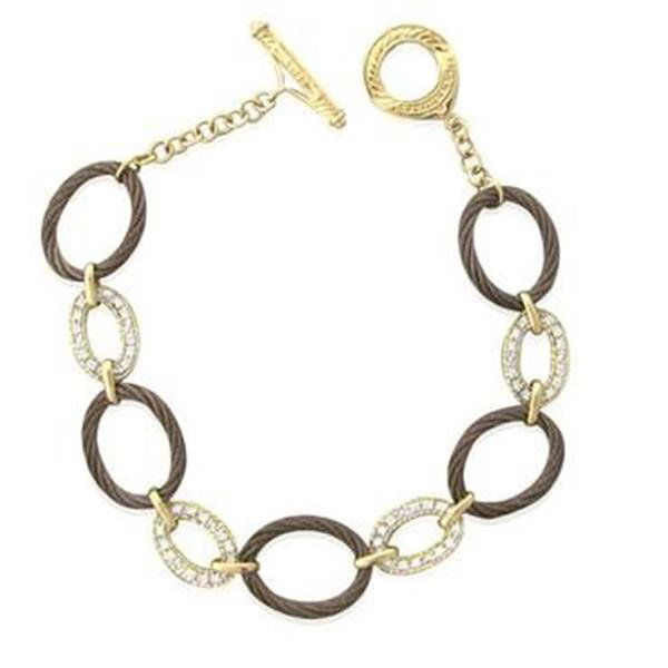 Charriol Celtique 18K Gold Steel Diamond Toggle: METAL: 18k gold, steel. GEMSTONES: diamonds- approx. 0.24ctw. MEASUREMENTS: 7" long, 12.2mm wide. MARKED: maker's mark, 750. WEIGHT: 8.0 grams. new. retails for $3495.Gemstones have not been