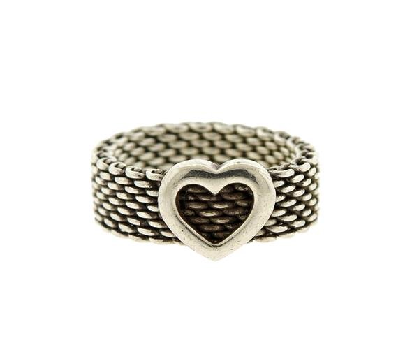 Tiffany & Co Sterling Somerset Mesh Heart Ring: METAL: sterling silver. MEASUREMENTS: ring size 5. Ring band is 8.5mm at widest point. MARKED: T&CO 925. WEIGHT:5.0 grams. Gemstones have not been graded for color and clarity ,and tested for clar