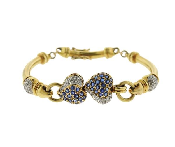 Modern 18K Gold Diamond Sapphire Bracelet: METAL: 18K gold. GEMSTONES: diamonds-approx. 0.40ctw(55diam), sapphires. MEASUREMENTS: bracelet is 6 3/4" long x 13mm at widest point. TESTED: 18K gold. WEIGHT: 25.3 grams. Gemstones have not bee