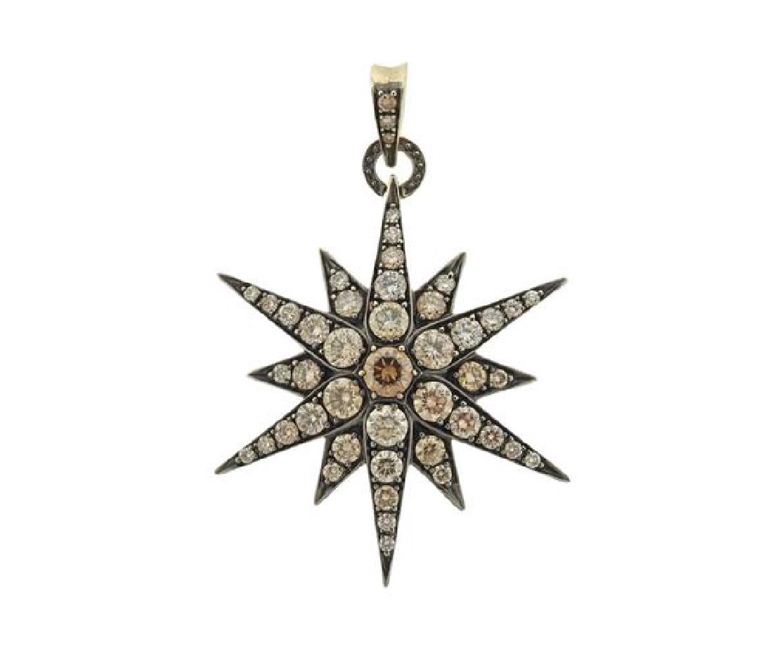 H.Stern 18K Gold Fancy Diamond Star Pendant: METAL: 18K gold, black rhodium. GEMSTONES: cognac fancy diamonds-approx 3.50ctw (VS1-VS2). Pendant comes with original IGL certificate card #2281200001. MEASUREMENTS: pendant is 48mm (including bale)