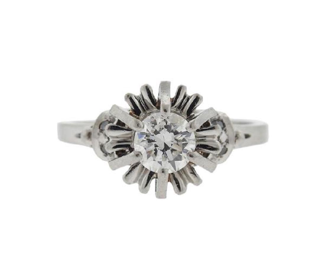 Platinum Diamond Engagement Ring: METAL: platinum. GEMSTONES: round brilliant cut diamond-approx. 0.60-0.65ct. MEASUREMENTS: ring size 6. Ring top is 14mm x 10.5mm at widest point. TESTED: platinum. Ring has engraved and dated on inne