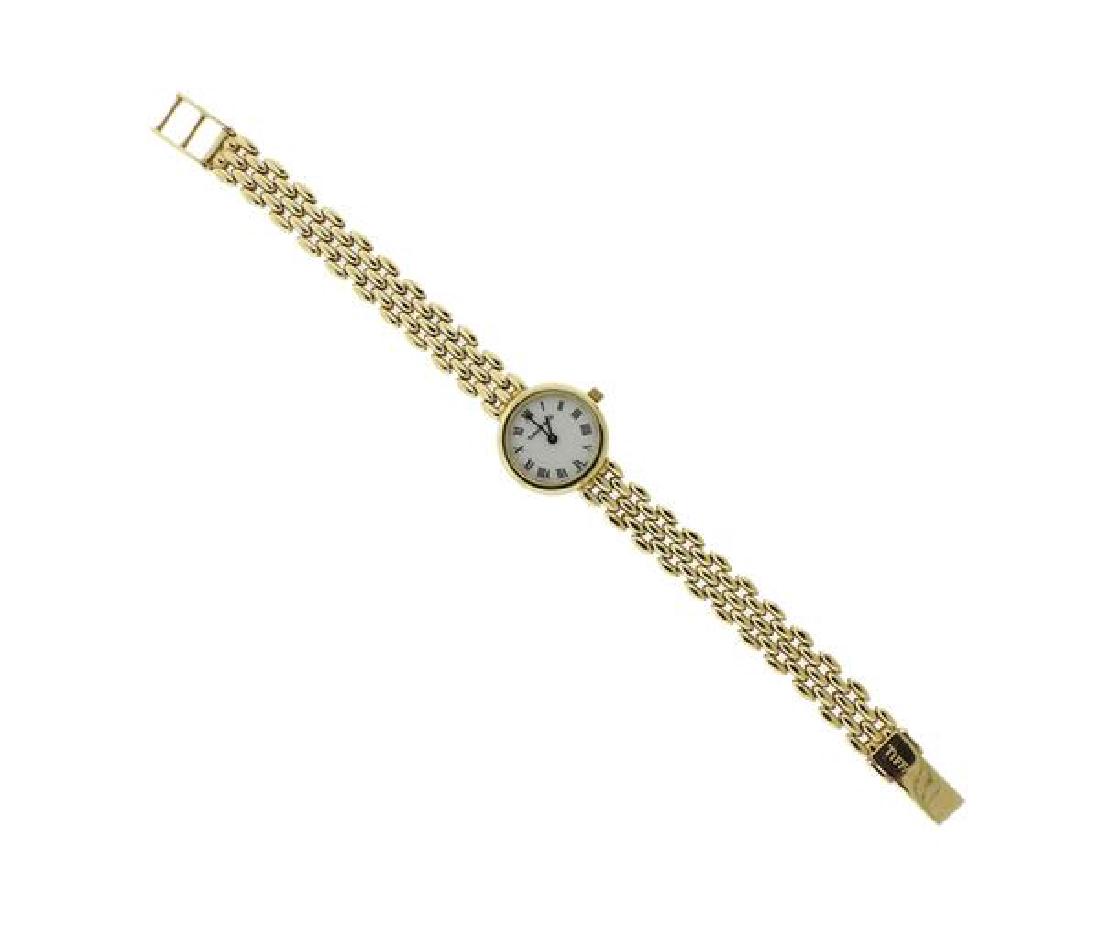 Tiffany & Co 14k Gold Watch: METAL: 14k gold. MEASUREMENTS: Case is 21mm in diameter (excl. crown). DIAL: white dial with black markers. MOVEMENT: Quartz, not in running order. WEIGHT: 27.2 grams. Gemstones have not been graded f