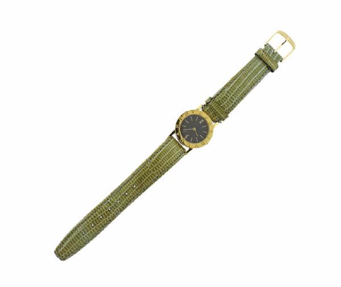 Bvlgari Bulgari 18K Gold Leather Strap Watch: METAL: 18K Gold. CASE: 26mm (excl. crown), crown is missing. DIAL: Black with gold stick markers. MOVEMENT: Quartz, not in running order. Comes with additional black leather strap. Gemstones have not