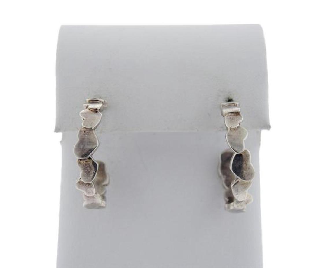 Tiffany & Co Paloma Picasso Sterling Hoop Earrings: METAL: sterling silver. MEASUREMENTS: earrings are 27mm in diameter x 6mm at widest point. Missing backs. MARKED: Paloma Picasso, T&Co. 925. WEIGHT: 7.6 grams. Gemstones have not been graded for c