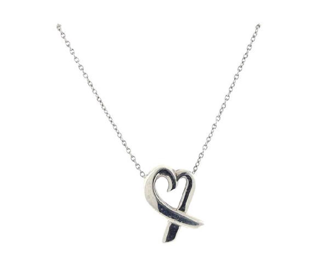 Tiffany & Co Paloma Picasso Sterling Heart Pendant: METAL: sterling silver. MEASUREMENTS: necklace is 17" long . Pendant is 16mm long x 12mm at widest point. MARKED: Tiffany &Co Paloma Picasso 925. WEIGHT: 2.7 grams. Gemstones have not been gr