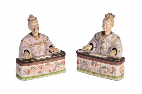 Couple of magots: Couple of magots of polychrome biscuit, garnished with dragons, heads and movable hands, cm 23x19x17