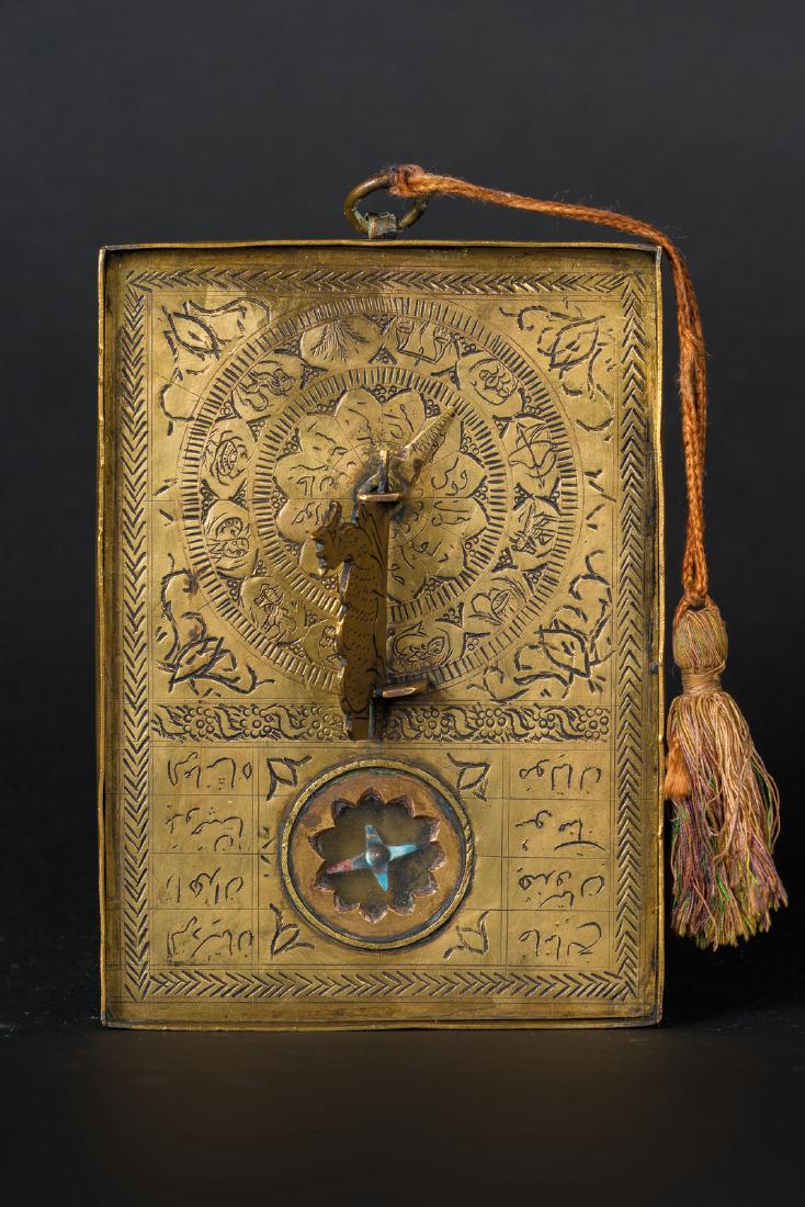 Arte Islamica A brass astrolabe engarved with: Islamic Art A brass astrolabe engarved with astrological signs and symbols Iran, 19th century . . Cm 10,00 x 14,50 x 1,50.