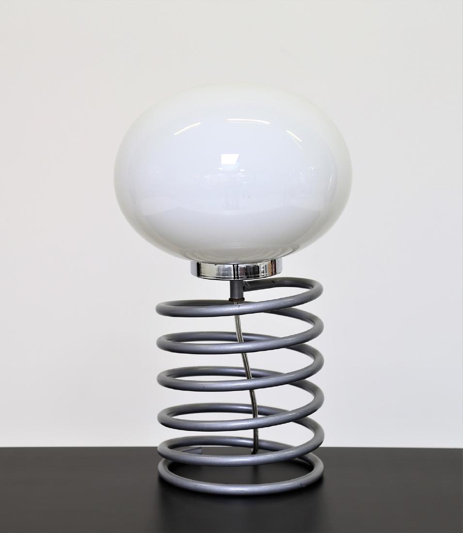 INGO MAURER Table lamp in painted metal and opal glass: Table lamp in painted metal and opal glass by Design M, 1960s. . Cm 24,00 x 38,00 x 24,00.