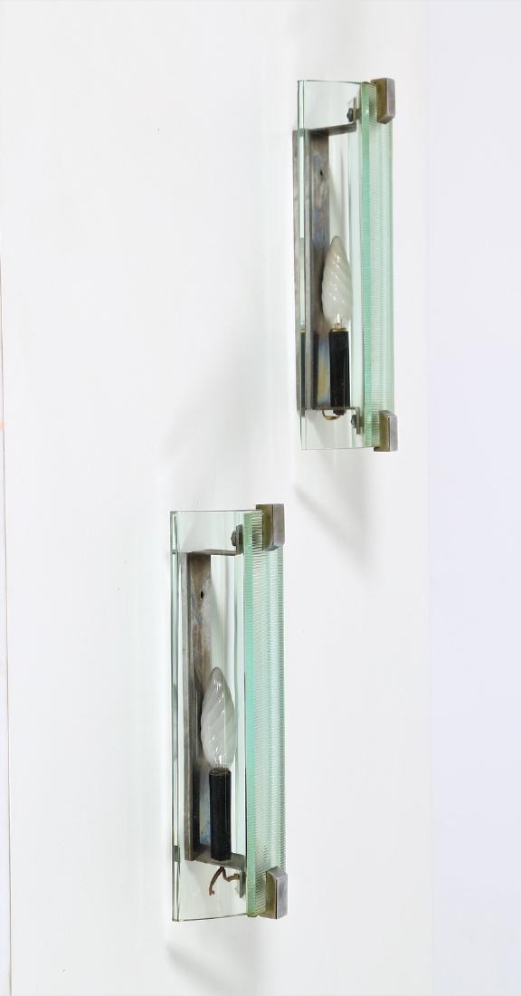 VECA Pair of metal and glass wall light, 1960s.: Pair of metal and glass wall light, 1960s. . Cm 13,00 x 28,00 x 8,00.