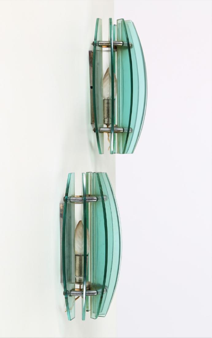 VECA Pair of metal and glass wall lights, 1960s .: Pair of metal and glass wall lights, 1960s . . Cm 17,00 x 28,00 x 12,00.