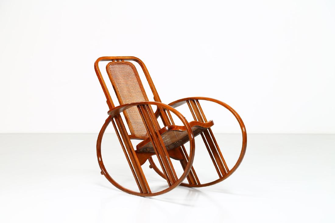 MAX FABIANI Rocking chair.: Rocking chair. . Cm 72,00 x 100,00 x 115,00. Curved beechwood and cane, mod. 267, for SocietÃ Antonio Volpe, Udine, 1914.