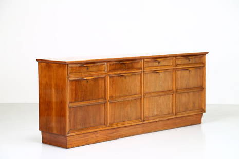 GUGLIELMO PECORINI Walnut sideboard.: Walnut sideboard. . Cm 252,00 x 101,00 x 55,00. Unique piece, part of the furniture of Casa Urbano Zaccagnini, Florence, 1935.